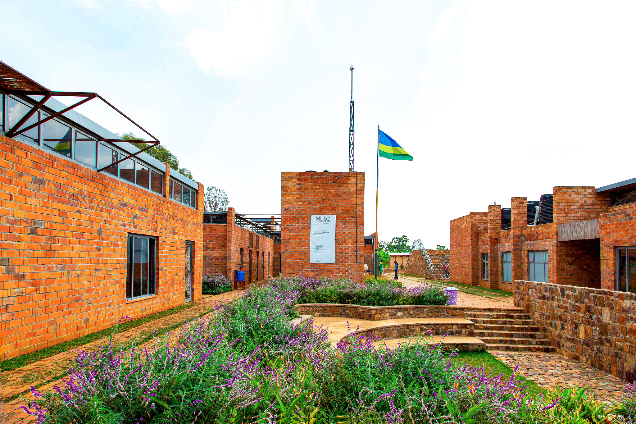 Community learning center with brick buildings arranged around open courtyards