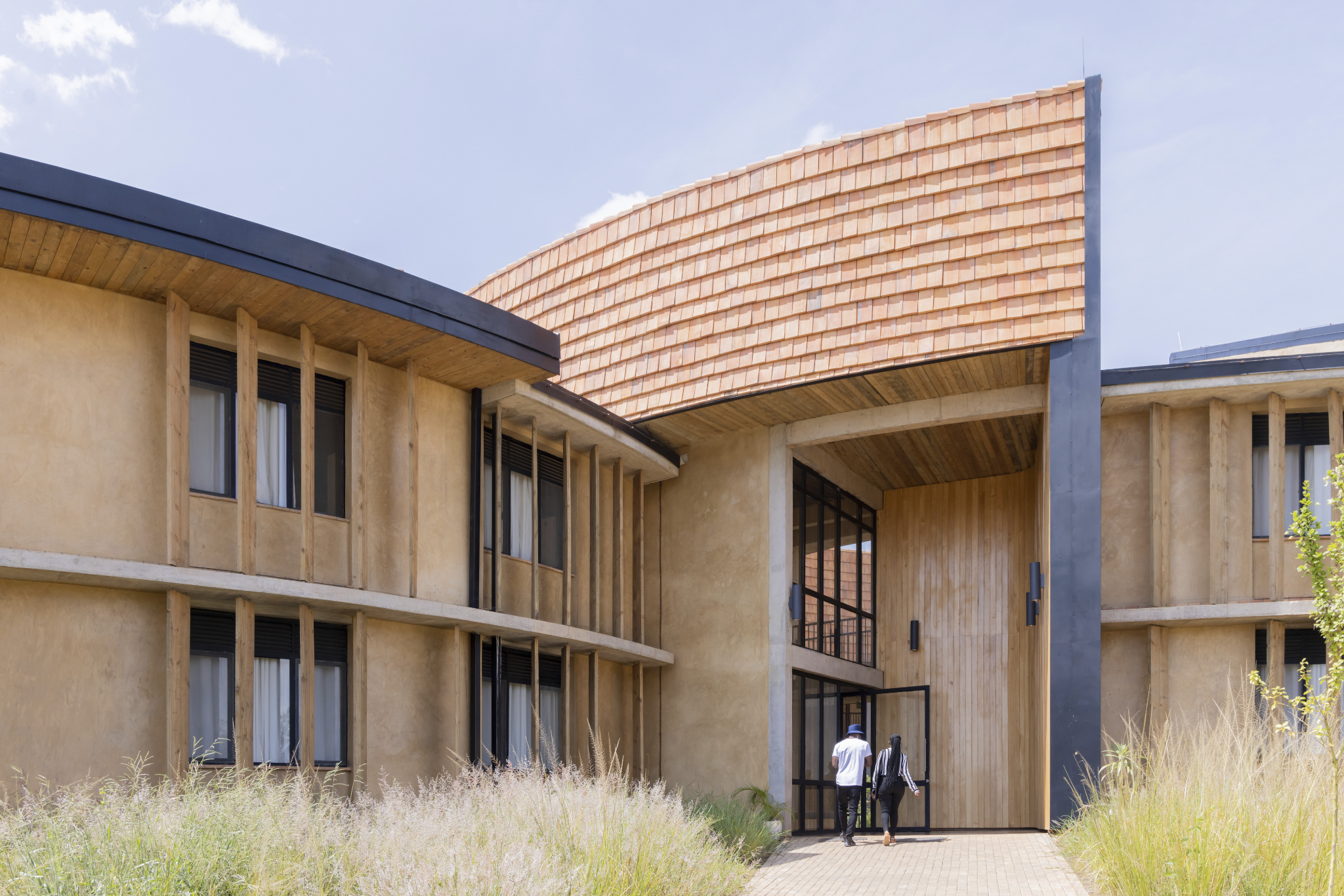 Close up of compressed earth block walls demonstrating hyperlocal construction techniques