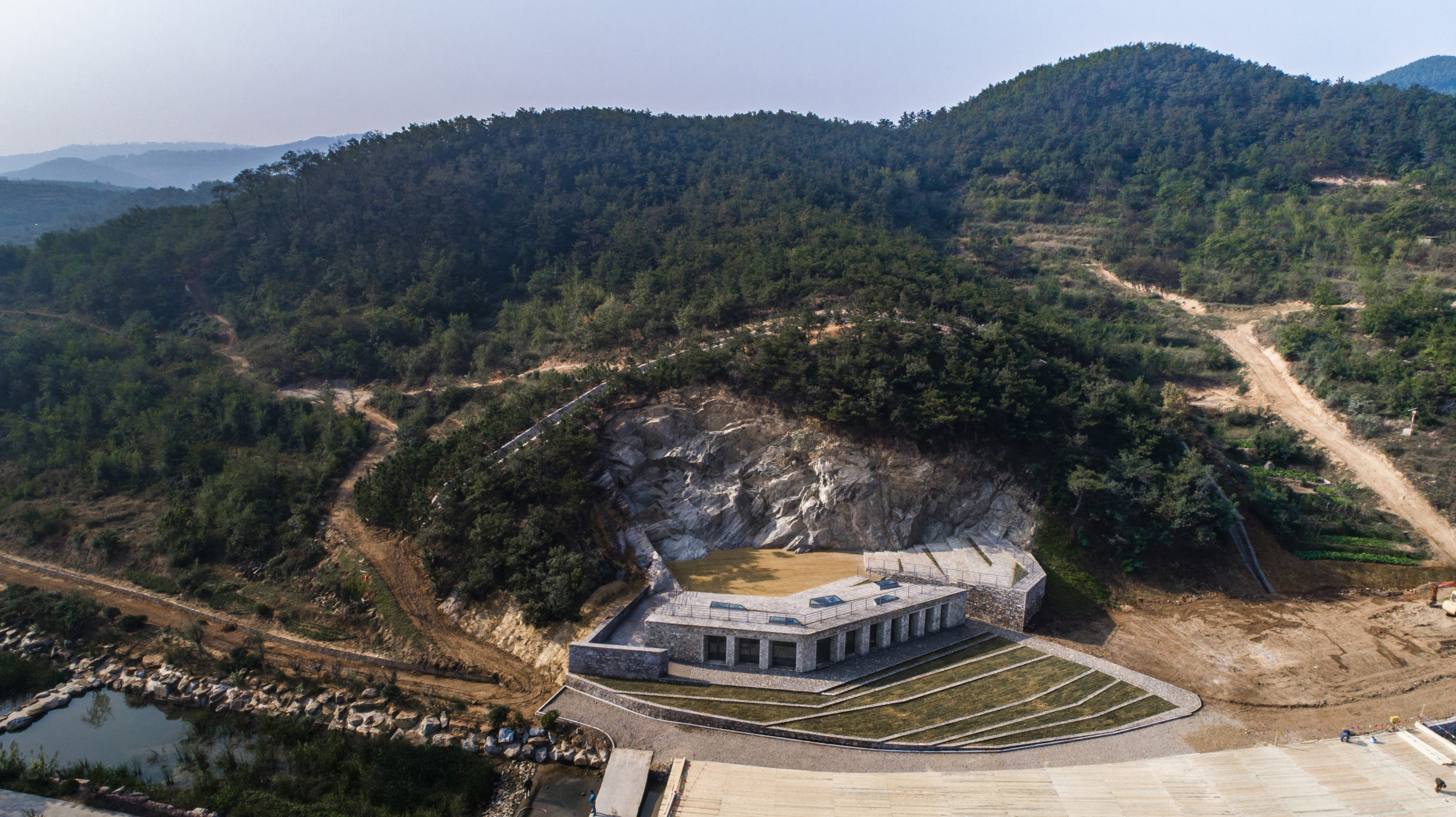 one-time abandoned stone quarry has been transformed into an open-air amphitheater and public community space