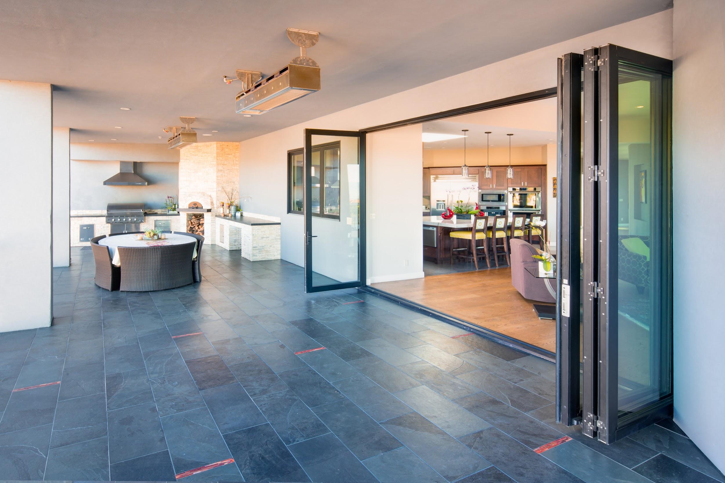 The Series 7950 Aluminum Bi-Fold Door from Western Window Systems opening onto a living space