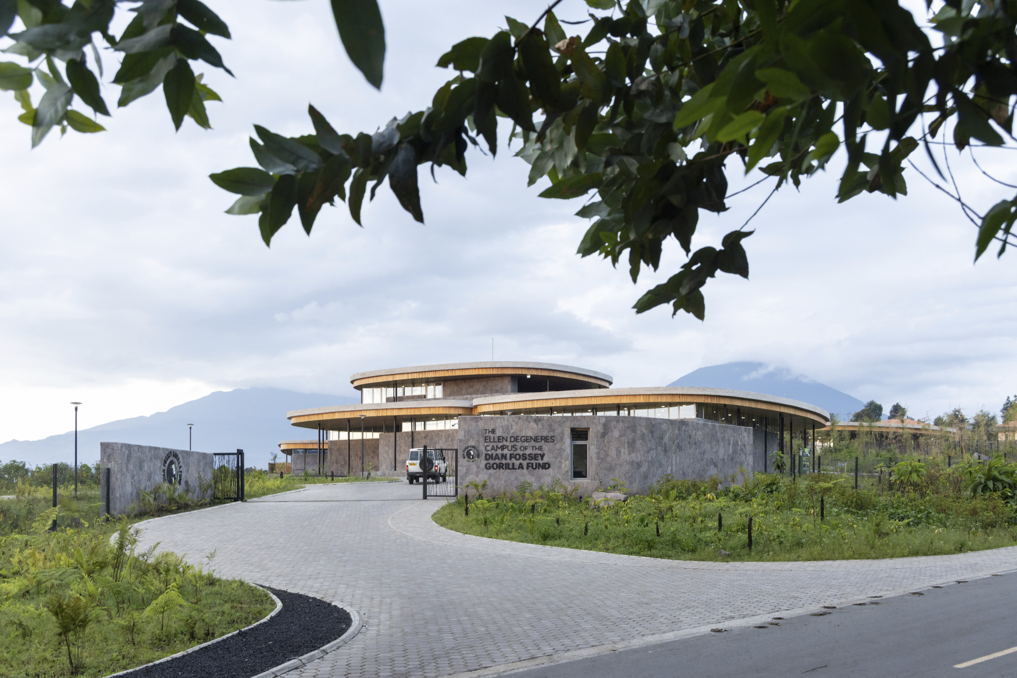 Conservation campus buildings constructed from local stone at the base of the Virunga Mountains