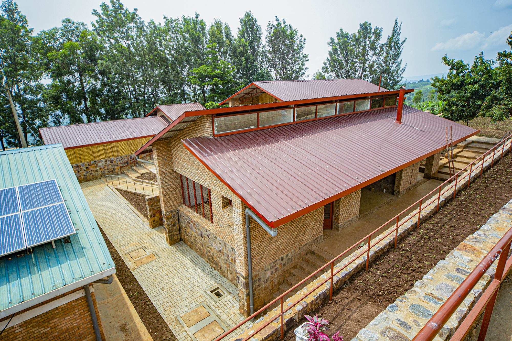 Terraced health center buildings responding to steep terrain