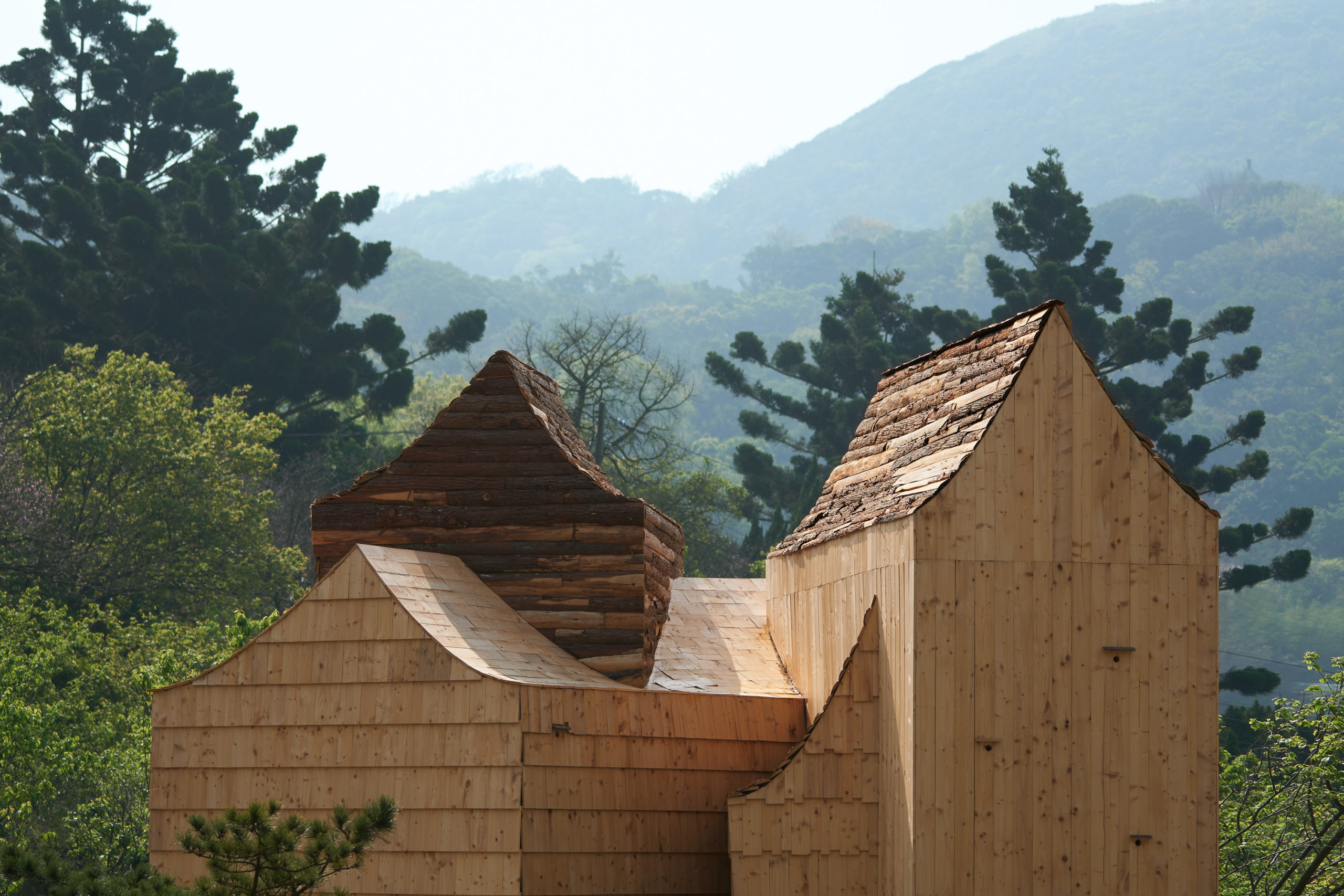 concave rooflines emphasize the various axes and complex geometry