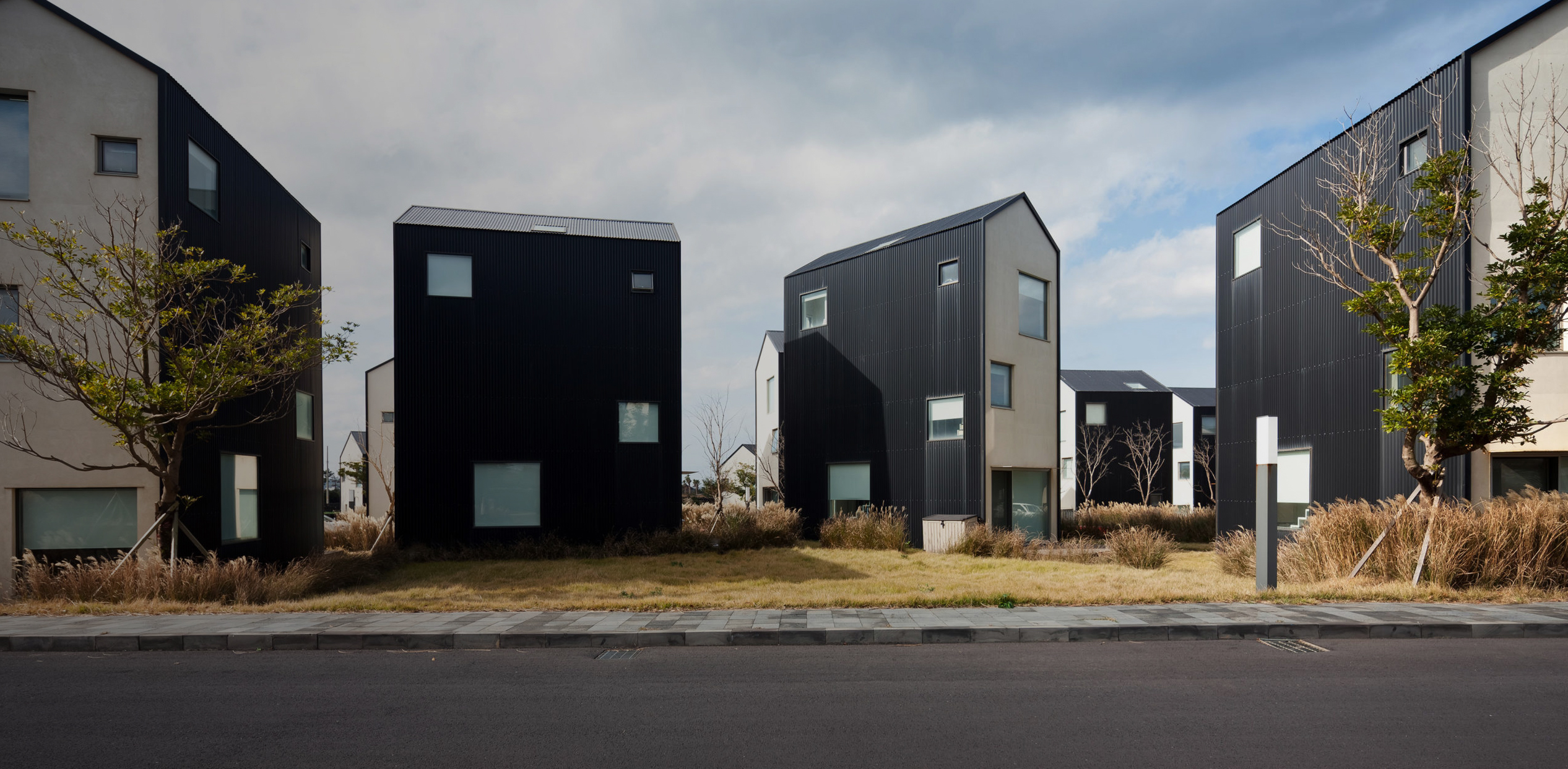 https://blog.architizer.com/wp-content/uploads/Enhancing-Community-with-Minimalist-Prisms-Hadohilljo-Townhouse-by-UNITEDLAB-Associates-LLC-Jeju-do-South-Kore-scaled-copy.jpg