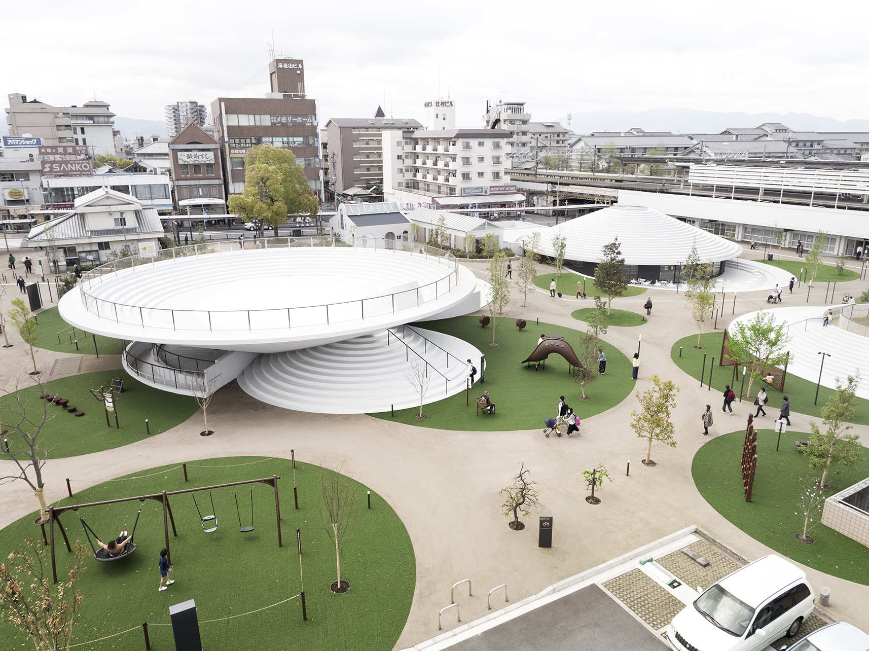 A semi-areal view of Tenri Station Plaza CoFuFun showcasing the circular pavilions and activity zones.